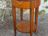 a small wooden table with a drawer on top of it