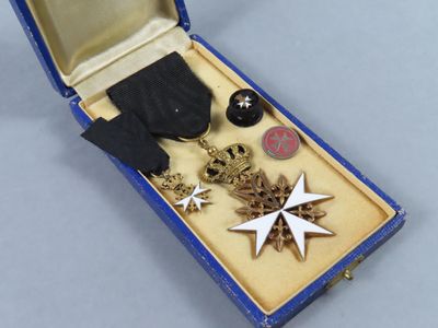 a box with a medal and other items in it