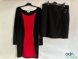 two pieces of black and red dress on a hanger next to a pair of black and red pants