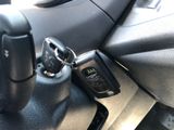 a close up of a remote control in a car