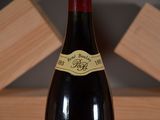 a bottle of wine that is sitting on a table