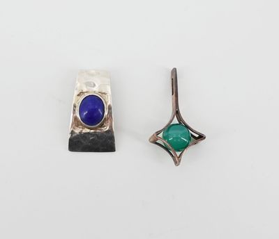 a pair of earrings with blue and green stones on them