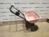 an image of a hand push cart with a pink bucket