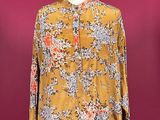 a woman ' s blouse on a mannequin mannequin mannequin mannequin mannequin mannequin mannequin mannequin mann