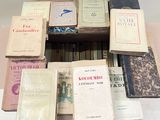 a lot of books that are sitting on a table