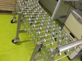a lot of metal tables that are on a green floor