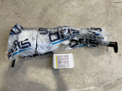 an umbrella that has been wrapped in plastic on the floor