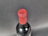 a bottle of wine that is sitting on a table