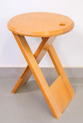 an image of a small wooden table with a wooden cross legs