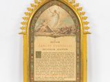 a plaque with a picture of jesus on it on display