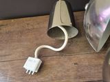 a light that is plugged into the wall next to a lamp