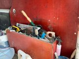 a tool box full of tools sitting on the floor