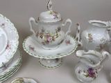 a table with a lot of plates and cups and saucers