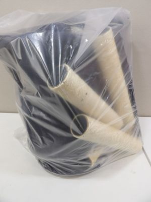 a bag of yarn and a pair of scissors on a toilet