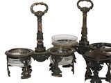 four different pieces of metal and glass on the table