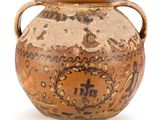 a brown vase with a handle on a white background