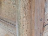 a close up of a wooden door with a handle on it