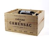 a wooden box with a bottle of wine inside of it