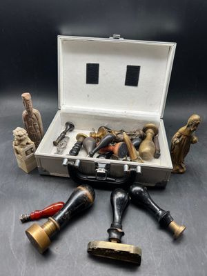 a suitcase with various tools in it on a table