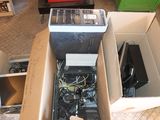 a box full of electronic equipment sitting on the floor