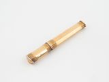 an old brass telescope on a white surface with a white background