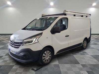 the white van is parked on a checkered floor in a room