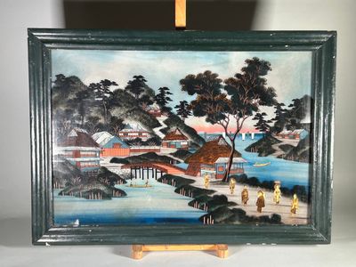une photo d'un tableau posé sur un chevalet, sur une table