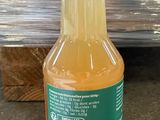 a bottle of orange juice sitting on the floor