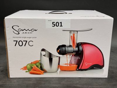a box with a juicer and a blender inside of it
