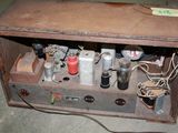 an old radio sitting on the floor in a room