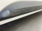 a close up of a car ' s door handle with a sticker on it