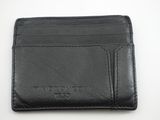 un portefeuille en cuir noir posé sur une table blanche