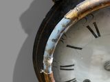 a close up of a clock with roman numerals on it