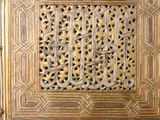 an image of a wooden door with a decorative design on it