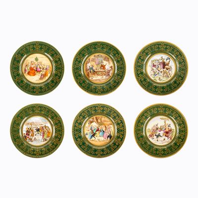six green and gold plates with a picture of a man and woman on them