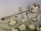 a lot of spoons and spoon spoons on the table