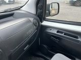 a view of the inside of a car from the driver ' s seat