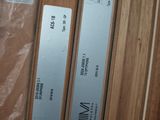 three wooden doors with labels on them in a room