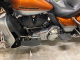 a orange motorcycle parked in a parking lot