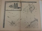 an open book with a drawing of a castle on it