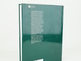 the back cover of a book with a green cover and a white background