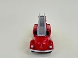 a red toy fire truck with a ladder on the back
