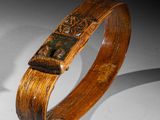 an image of a wooden bracelet with a cross on it