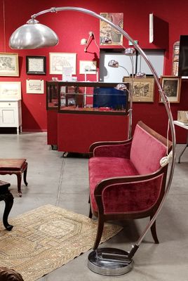 a living room with red walls and furniture in it