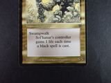 a close up of a card on a table with a black background