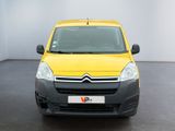 yellow citrole van parked in a white room with a black floor