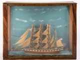 a picture of a ship that is in a wooden frame