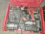 a red tool box with tools in it on the floor