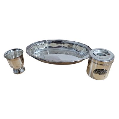 an image of a silver plate with two cups and a spoon