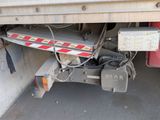 an image of a truck that is parked on the street